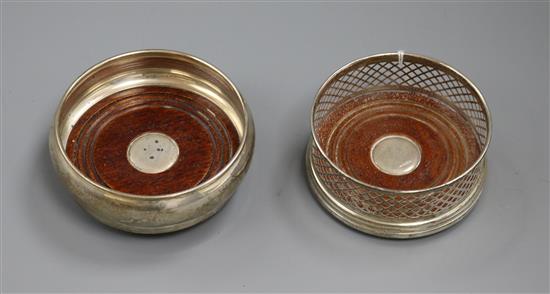 Two small modern silver wine coasters.